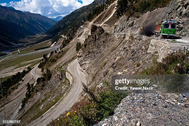 Truck carries supplies to Ladakh on a treacherous road of Zojila Pass before the foundation stone-laying ceremony for a tunnel on the Srinagar-Leh...