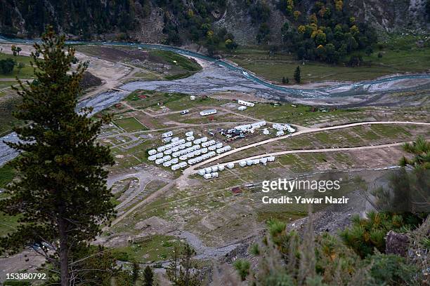 Indian army tents stand at the base of Zojila Pass before the foundation stone-laying ceremony for a tunnel on the Srinagar-Leh highway on October 4,...