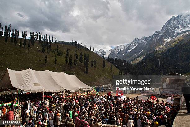 People wait for Rahul Gandhi, a lawmaker and son of India's ruling Congress party chief Sonia Gandhi, before the foundation stone-laying ceremony for...