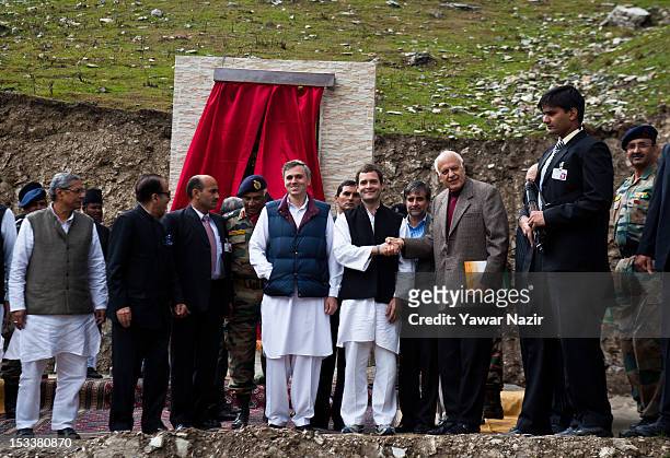 Rahul Gandhi , a lawmaker and son of India's ruling Congress party chief Sonia Gandhi, shakes hands with Farooq Abdullah , former Chief Minister of...
