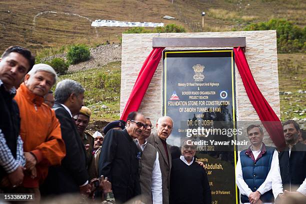 Rahul Gandhi , a lawmaker and son of India's ruling Congress party chief Sonia Gandhi, stands with Omar Abdullah, Chief Minister of Jammu and...