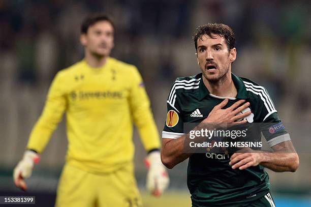 Panathinaikos' Toche celebrates after scoring against Tottenham during their Europa League football match Panathinaikos vs Tottenham at the Olympic...