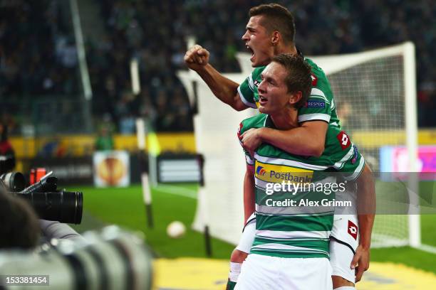 Luuk de Jong of Moenchengladbach celebrates his team's first goal with team mate Granit Xhaka during the UEFA Europa League group C match between...