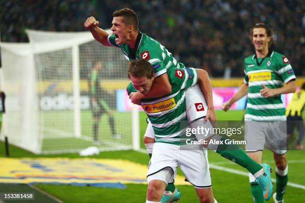 Luuk de Jong of Moenchengladbach celebrates his team's first goal with team mates Granit Xhaka and Roel Brouwers during the UEFA Europa League group...