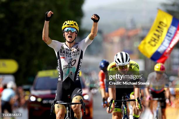 Pello Bilbao of Spain and Team Bahrain Victorious celebrates at finish line as stage winner ahead of Georg Zimmermann of Germany and Team...