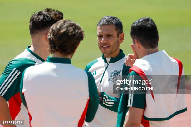 Mexico's head coach Jaime Lozano speaks with his staff during a training session in Carson, California, on July 15 a day before the CONCACAF 2023...