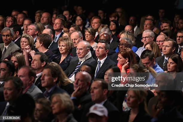 Members of the audience watch Democratic presidential candidate, U.S. President Barack Obama debate Republican presidential candidate, former...