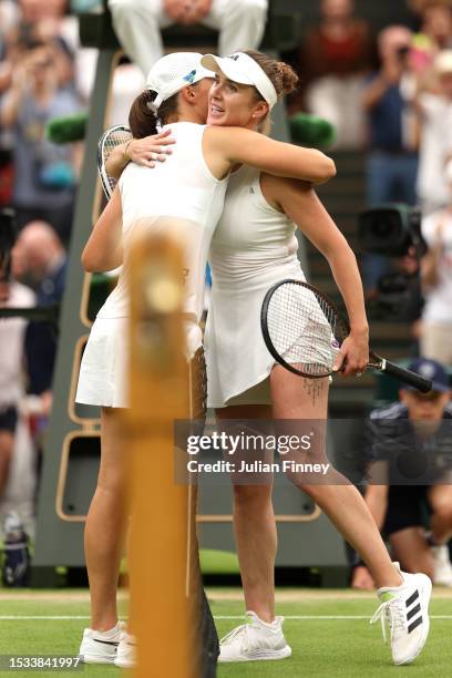 Elina Svitolina of Ukraine embraces Iga Swiatek of Poland following the Women’s Singles Quarter Final match during day nine of The Championships...