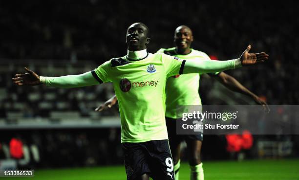 Newcastle player Papiss Cisse and Shola Ameobi celebrate the third Newcastle goal during the UEFA Europa League match between Newcastle United and FC...