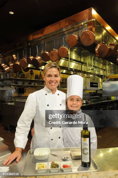 Celebrity Chef Cat Cora Cooks With Grace LaFountain, The Winner Of The National Loukoumi's Celebrity Cookbook "Favorite Childhood Recipe" Contest at...