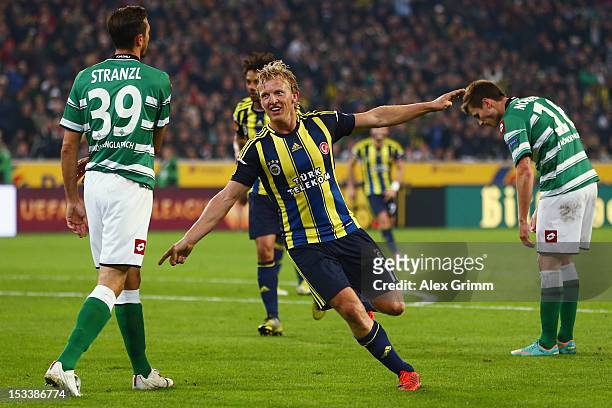 Dirk Kuyt of Fenerbahce celebrates his team's third goal during the UEFA Europa League group C match between Borussia Moenchengladbach and Fenerbahce...