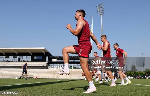 Ben Youngs, Jack van Poortvliet and Elliot Daly of England warm up with teammates prior to the England Rugby Training Session at Payanini Center on...