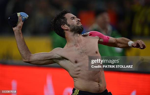 Fenerbahce SK defender Goekhan Goenuel throws his shirt after the UEFA Europa League Group C football match Borussia Moenchengladbach vs Fenerbahce...