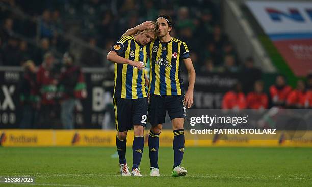 Fenerbahce's midfielder Mehmet Topal and Serbian striker Milos Krasic celebrate after the UEFA Europa League Group C football match Borussia...