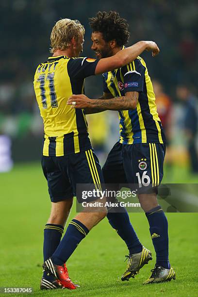 Cristian of Fenerbahce celebrates his team's fourth goal with team mate Dirk Kuyt during the UEFA Europa League group C match between Borussia...