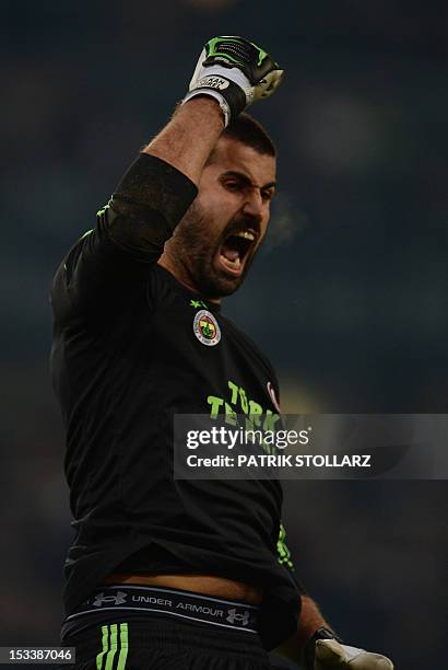 Fenerbahce's goalkeeper Demirel Volkan celebrates after the UEFA Europa League Group C football match Borussia Moenchengladbach vs Fenerbahce SK in...