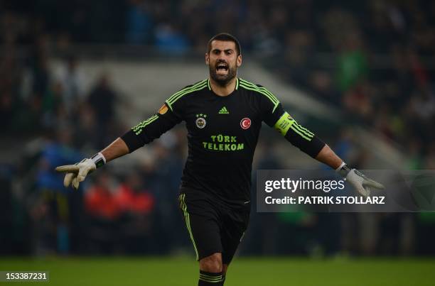 Fenerbahce´s goalkeeper Demirel Volkan celebrates during the UEFA Europa League Group C football match Borussia Moenchengladbach vs Fenerbahce SK in...