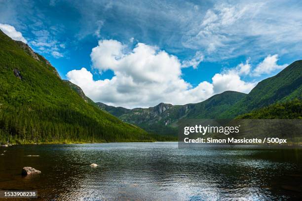 scenic view of lake by mountains against sky,quebec,canada - parc national de la gaspésie stock pictures, royalty-free photos & images