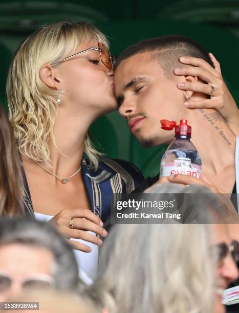 Mia Regan and Romeo Beckham kiss as they attend day nine of the Wimbledon Tennis Championships at the All England Lawn Tennis and Croquet Club on...