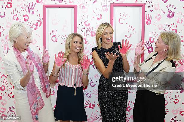 National Breast Cancer Foundation patrons, Westpac CEO, Gail Kelly, Anne Kelly, Sarah Murdoch and Carol O'Hare share a joke whilst displaying their...