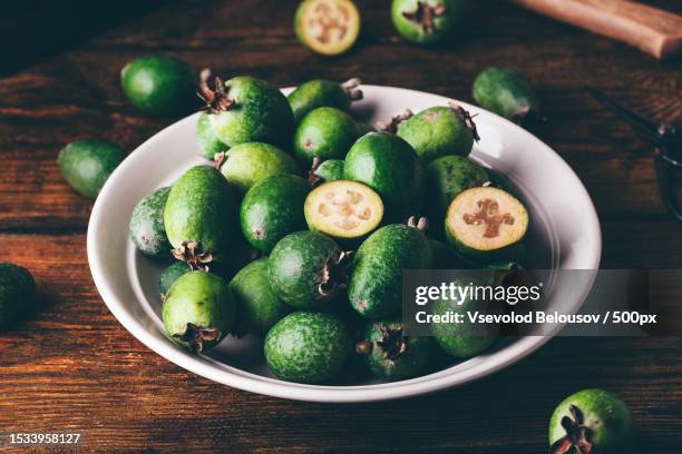 high angle view of avocado in bowl on table - guava jam stock pictures, royalty-free photos & images