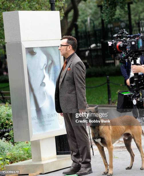 Michael Emerson with Boker the dog who plays "Bear" filming on location for "Person Of Interest" on October 4, 2012 in New York City.