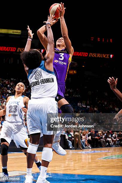 Candace Parker of the Los Angeles Sparks shoots the ball against Taj McWilliams-Franklin of the Minnesota Lynx during Game One of the 2012 WNBA...