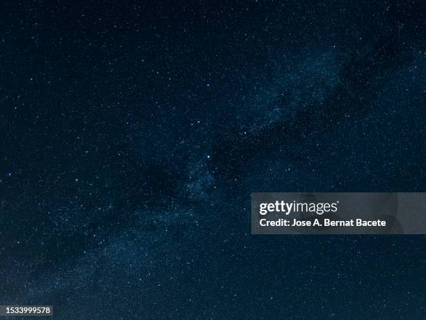 full frame of the milky way crosses the starry sky. - campo de estrelas imagens e fotografias de stock