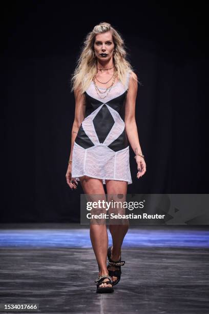 Model walks the runway during the Rebekka Ruetz Runway Show as part of the W.E4. Fashion Day at Verti Music Hall on July 11, 2023 in Berlin, Germany.