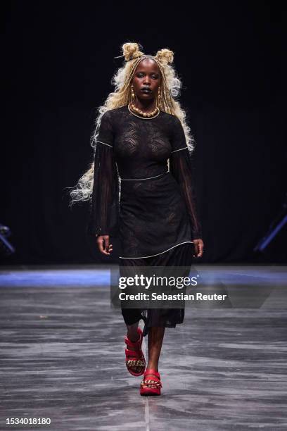 Model walks the runway during the Rebekka Ruetz Runway Show as part of the W.E4. Fashion Day at Verti Music Hall on July 11, 2023 in Berlin, Germany.