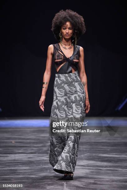 Model walks the runway during the Rebekka Ruetz Runway Show as part of the W.E4. Fashion Day at Verti Music Hall on July 11, 2023 in Berlin, Germany.