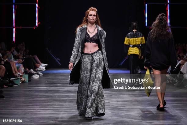 Model walks the runway during the Rebekka Ruetz Runway Show as part of the W.E4. Fashion Day at Verti Music Hall on July 11, 2023 in Berlin, Germany.