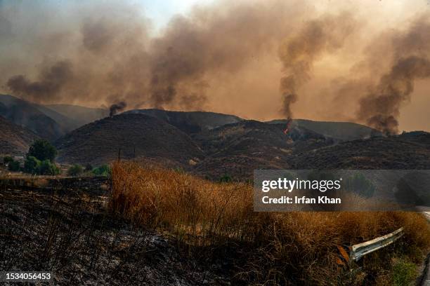 Rabbit Fire smoke billows from charred mountains along Gilman Spring Road in Moreno Valley on Saturday, July 15, 2023 in Riverside County, CA.