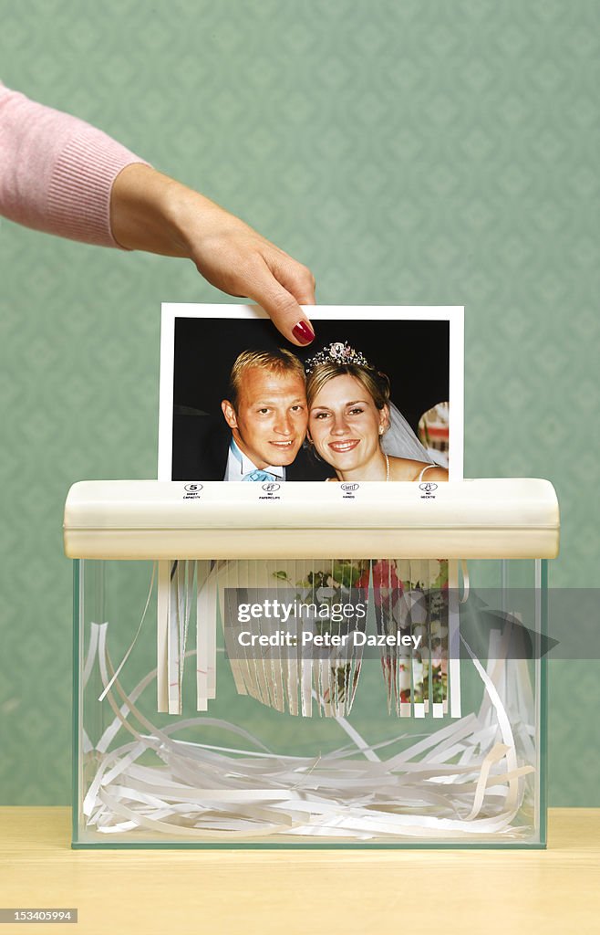 Divorced wife shredding wedding photo