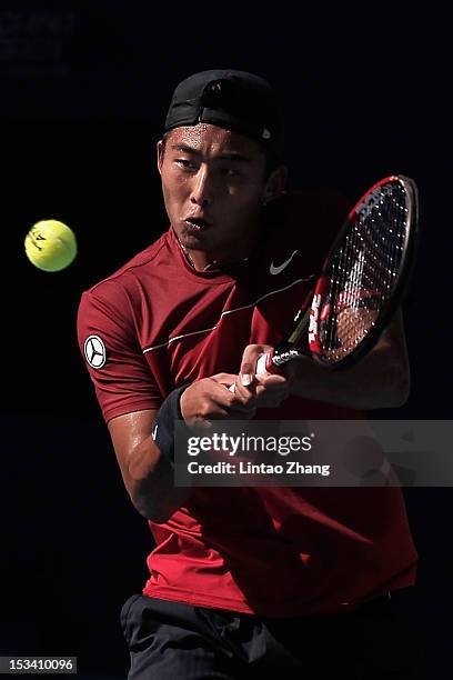 Ze Zhang of China hits a backhand during the quarter-finals of the China Open on October 5, 2012 in Beijing, China.