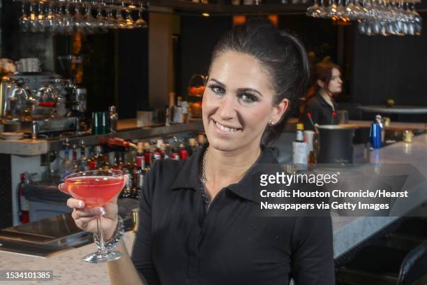 Pontente Bartender Jessica Mathey holds a Dante's Inferno - Bulleit Rye, Herring Cherry Liqueur, Chili Infused Aperol, Lemon Juice Tuesday, Feb. 21...