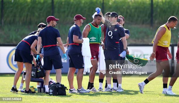 Anthony Watson cools down as he is sprayed with water during the England training session held at the Payanini Center on July 11, 2023 in Verona,...