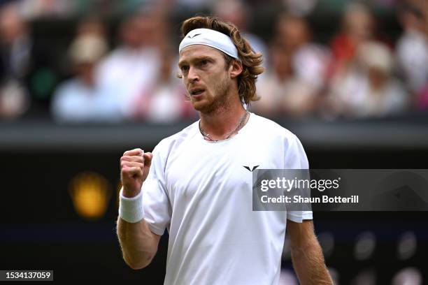 Andrey Rublev celebrates against Novak Djokovic of Serbia in the Men's Singles Quarter Final match during day nine of The Championships Wimbledon...