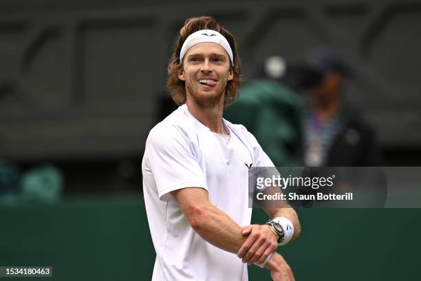 Andrey Rublev reacts against Novak Djokovic of Serbia in the Men's Singles Quarter Final match during day nine of The Championships Wimbledon 2023 at...