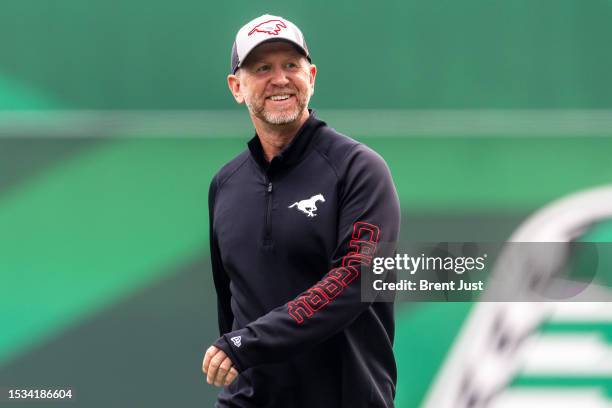 Head coach Dave Dickenson of the Calgary Stampeders on the field before the game between the Calgary Stampeders and Saskatchewan Roughriders at...