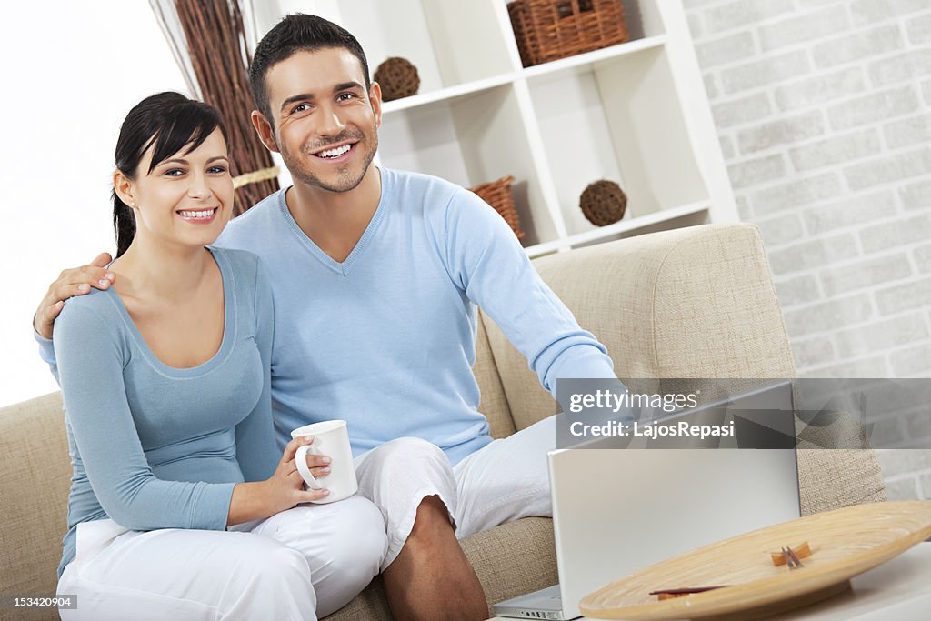 Young happy couple in the living room