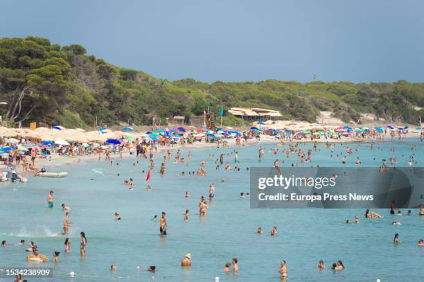 Several people bathe at Ses Salines beach, on 11 July, 2023 in Ibiza, Balearic Islands, Spain. Data from the Hotel Business Federation of the...