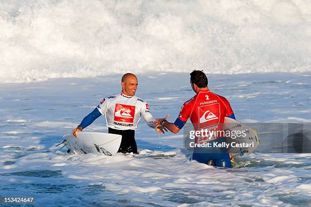 Times ASP World Champion Kelly Slater of the United States shakes hands with Joel Parkinson of Australia after defeating him in the Semi Finals of...