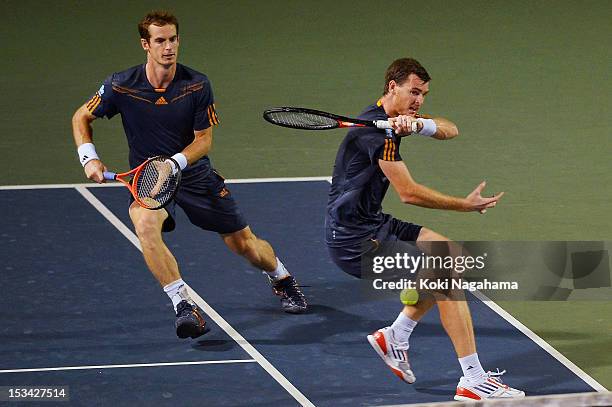 Andy Murray and Jamie Murray of Great Britain in action in their quater final match against Radek Stepanek of the Czech Republic and Leander Paes of...