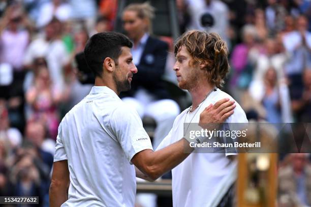 Novak Djokovic of Serbia acknowledges Andrey Rublev following the Men's Singles Quarter Final match during day nine of The Championships Wimbledon...