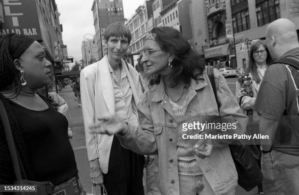View of, from left, transgender rights activists Reverend Moshay Moses, Chelsea Goodwin, and Sylvia Rivera as they talk on West 14th Street , New...