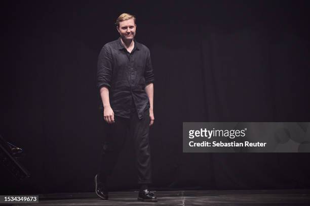 Designer Danny Reincke is seen on the runway during the Danny Reincke Runway Show as part of the W.E4. Fashion Day at Verti Music Hall on July 11,...
