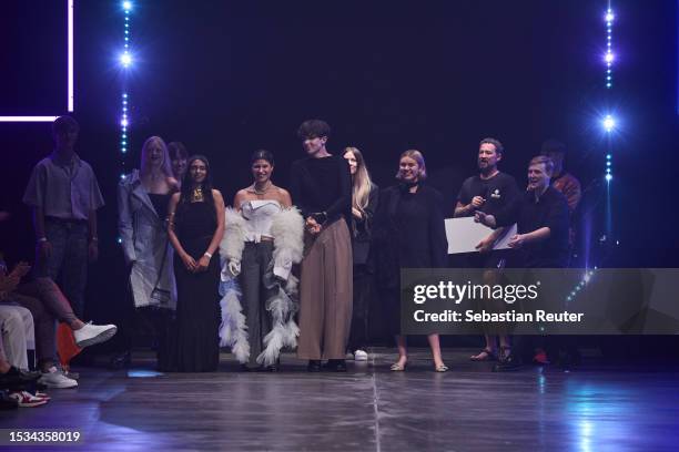 Designers Kilian Kerner, Rebekka Ruetz, Marcel Ostertag, Danny Reincke and contest participants are seen on the runway during the Danny Reincke...