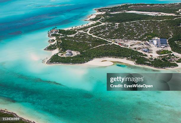 Aerial view of the small atolls, lagoon islands and turqouis waters of the carribean sea of the Exumas seen from an airplane on June 15, 2012 in The...