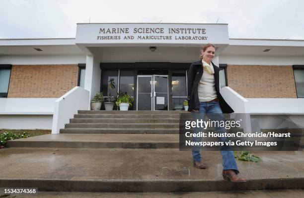 S Marine Science Institute Communication Director Sally Palmer leaves one of the campus' building that suffered damage during Hurricane Harvey...